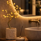 Bonsai Tree 36-LED lamp used as warm decorative lighting beside a bathroom sink