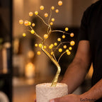 Bonsai Tree 36-LED lamp held by hand with warm glowing lights