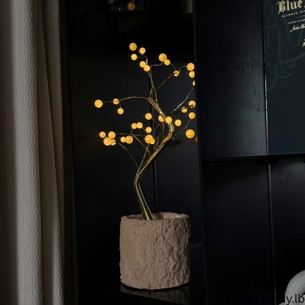 Bonsai Tree 36-LED lamp glowing beside a window in a dark room