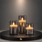 Glass flameless LED candle set in smoky grey glass on black display