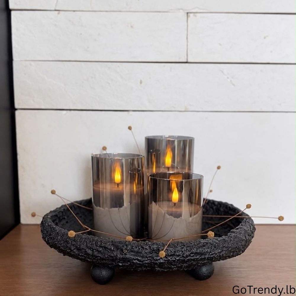 Three smoky glass flameless LED candles displayed on a decorative tray