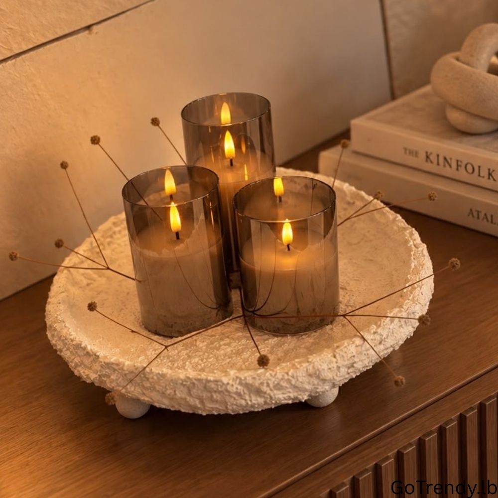 Three glass flameless LED candles with warm white glow