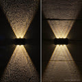 Modern waterproof solar wall light with up and down LED lighting effect for outdoor spaces