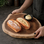 Natural acacia wood serving board for cheese, charcuterie, bread, and appetizer presentation
